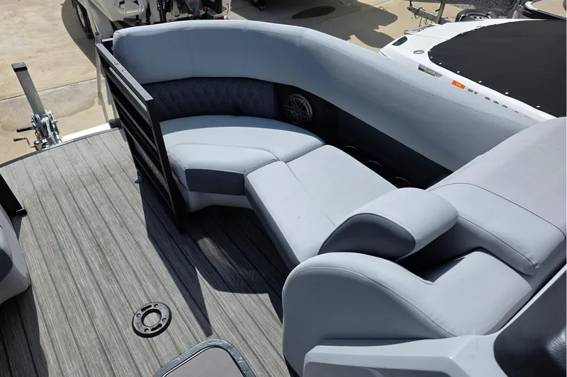 Slide: The Image of Luxurious seating on 2021 Harris Solstice 230 SL pontoon boat, featuring sleek gray upholstery. - 7