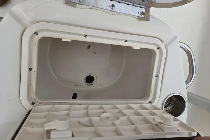 Slide: The Image of Open storage compartment on 2014 Carolina Skiff Sea Skiff 21 CC boat. - 15