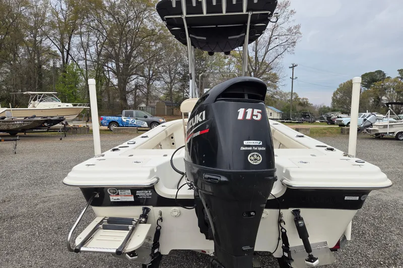 Slide: The Image of 2014 Carolina Skiff Sea Skiff 21 CC with Suzuki 115 outboard motor in a boatyard. - 6