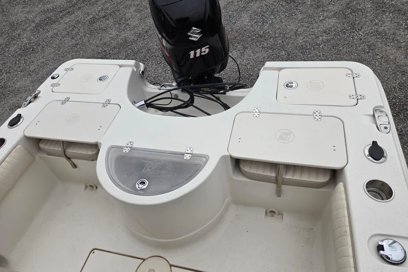 Slide: The Image of 2014 Carolina Skiff Sea Skiff 21 CC boat deck with Suzuki 115 outboard motor. - 7
