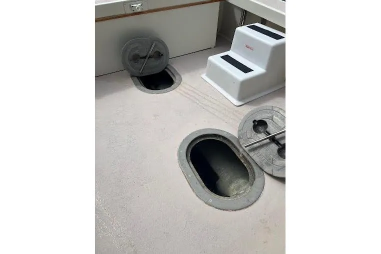 Slide: The Image of 1998 General Marine Custom Downeast boat deck with open hatches and steps. - 13