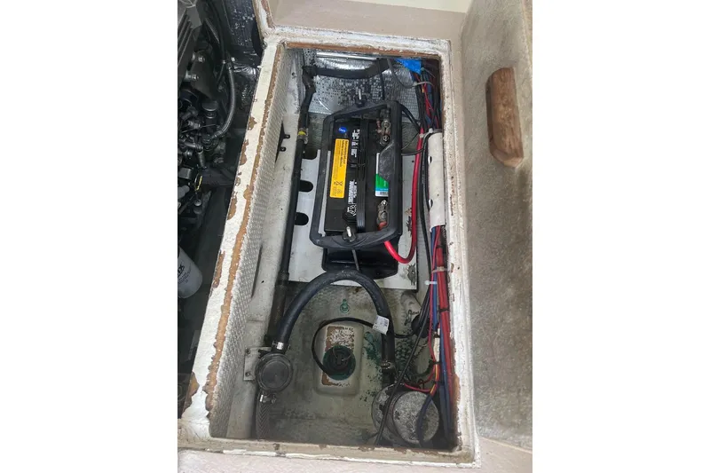 Slide: The Image of Battery compartment of a 1998 General Marine Custom Downeast boat, showing wiring and connections. - 15