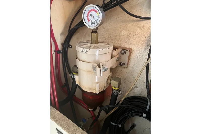 Slide: The Image of Fuel filter system in a 1998 General Marine Custom Downeast boat engine compartment. - 18