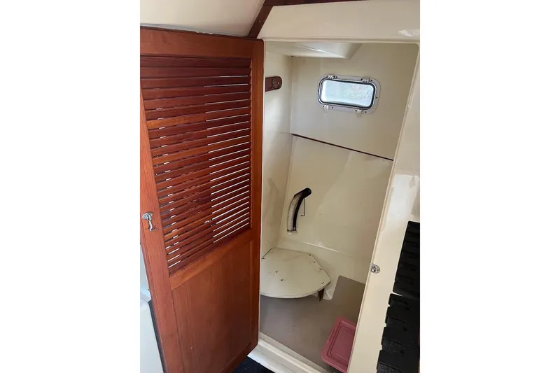 Slide: The Image of 1998 General Marine Custom Downeast boat interior with wooden door and small window. - 22