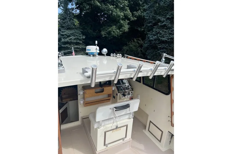 Slide: The Image of 1998 General Marine Custom Downeast boat interior with fishing rod holders and navigation equipment. - 7