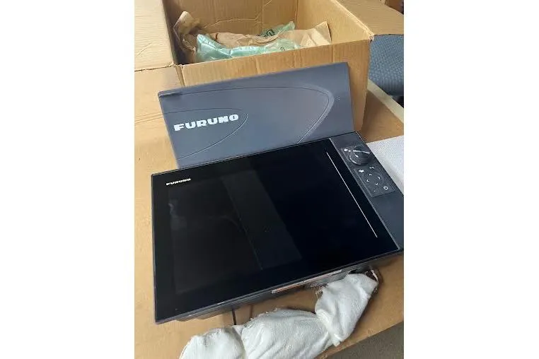 Slide: The Image of Furuno marine navigation equipment in box, compatible with 1998 General Marine Custom Downeast. - 9