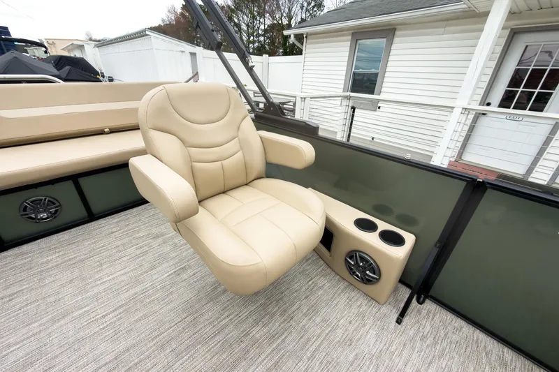 Slide: The Image of Luxurious seating on 2026 Godfrey Sweetwater Xperience 20' pontoon boat, featuring cup holders and speakers. - 10