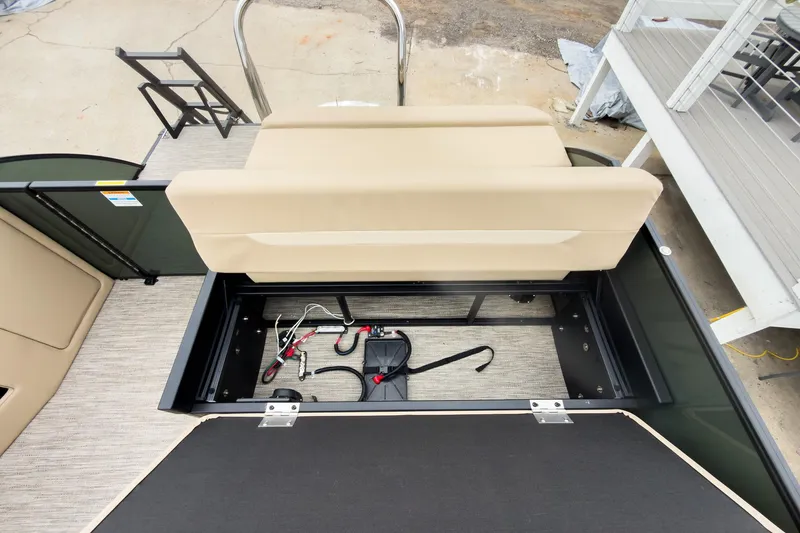 Slide: The Image of 2026 Godfrey Sweetwater Xperience 20' pontoon with open storage compartment and flip lounge seat. - 20