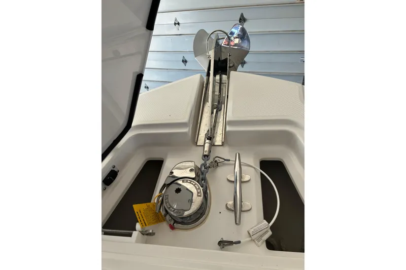 Slide: The Image of Anchor system of 2020 Edgewater 262CC boat in a garage setting. - 11