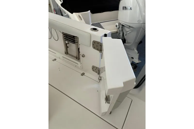 Slide: The Image of 2020 Edgewater 262CC boat with open hatch and Yamaha engine visible. - 16