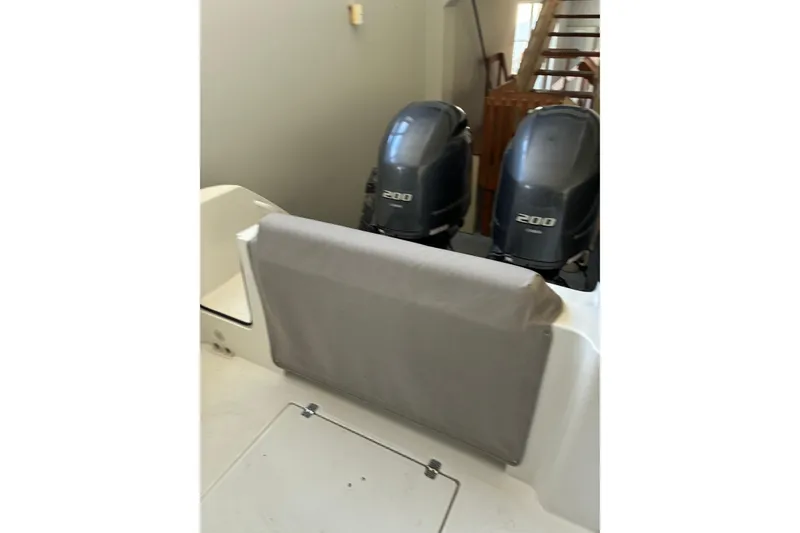 Slide: The Image of 2020 Edgewater 262CC boat with dual 200 horsepower engines, rear seating view. - 4