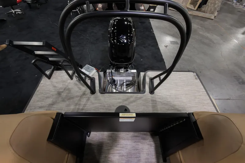 Slide: The Image of 2026 Godfrey Sweetwater 22' Tritoon rear view with motor and seating area. - 18