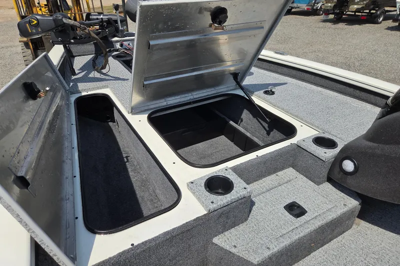 Slide: The Image of 2021 Tracker Pro Team 175 TXW Tournament Edition boat storage compartments open. - 10