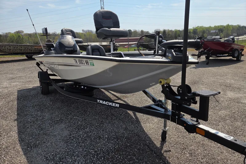 Slide: The Image of 2021 Tracker Pro Team 175 TXW Tournament Edition boat on trailer, parked outdoors. - 2