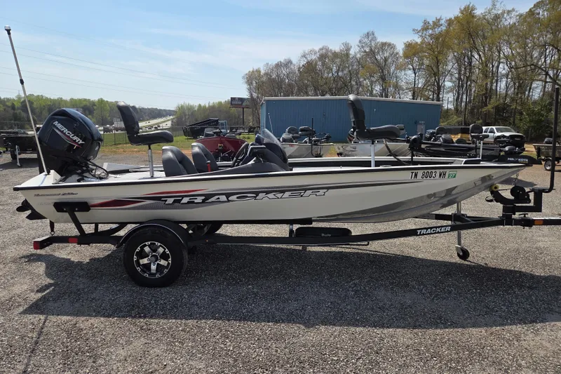 Slide: The Image of 2021 Tracker Pro Team 175 TXW Tournament Edition boat on trailer, parked outdoors. - 3