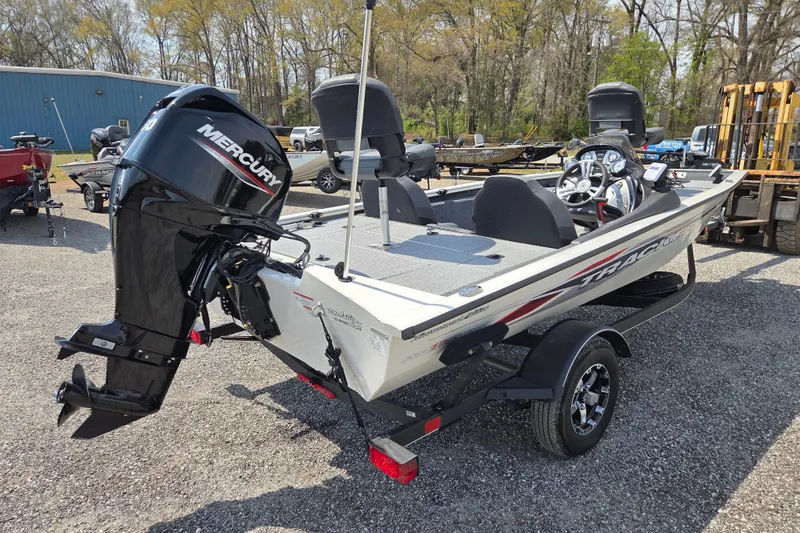Slide: The Image of 2021 Tracker Pro Team 175 TXW Tournament Edition boat with Mercury engine, parked outdoors. - 4