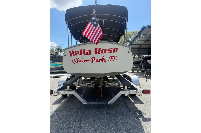 Slide: The Image of 2004 Duffy 18 electric boat named "Bella Rose" in Winter Park, FL, with American flag. - 7
