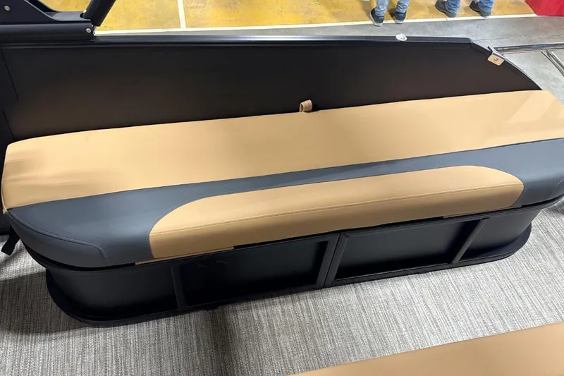 Slide: The Image of 2026 Godfrey Monaco 23' Tritoon lounge seat, tan and black upholstery, showroom display. - 8