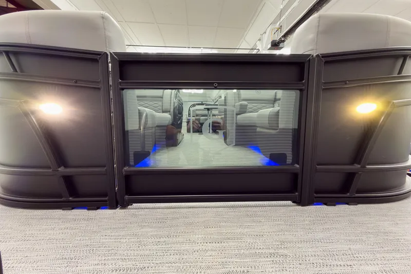 Slide: The Image of 2026 Godfrey Monaco 23' Tritoon interior with modern seating and ambient lighting. - 13