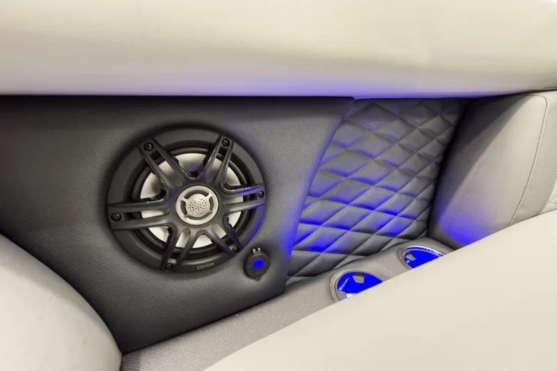 Slide: The Image of Luxurious interior of 2026 Godfrey Monaco 23' Tritoon with speaker and blue LED lighting. - 18