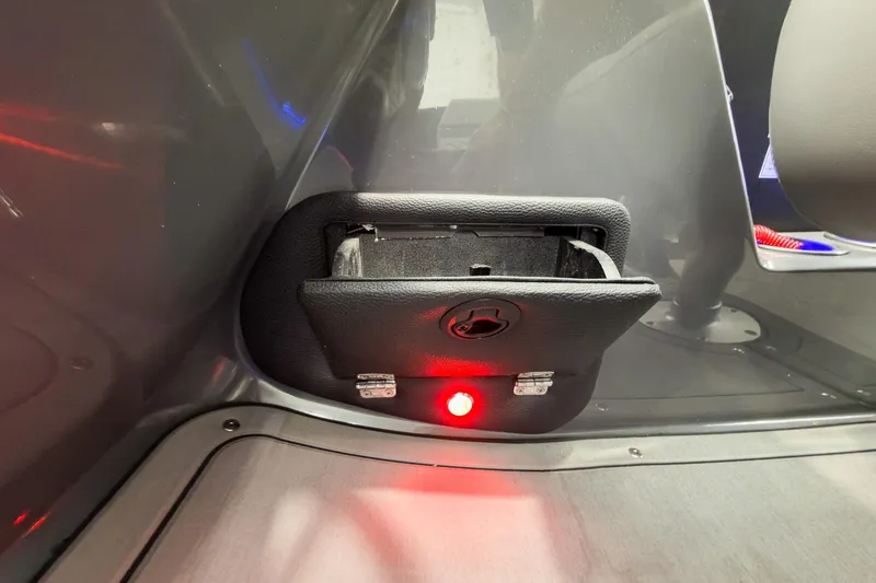 Slide: The Image of Interior detail of 2026 Godfrey Monaco 23' Tritoon, featuring a storage compartment with red light. - 25