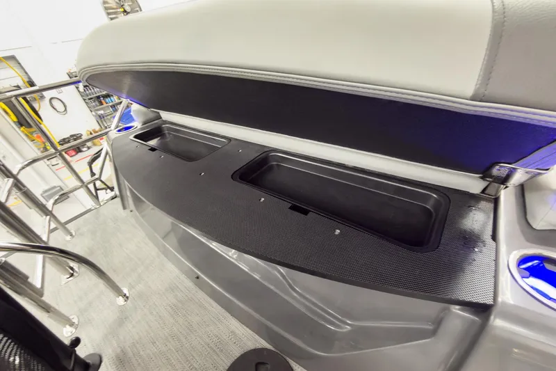 Slide: The Image of 2026 Godfrey Monaco 23' Tritoon storage compartment with flip lounge seating. - 40