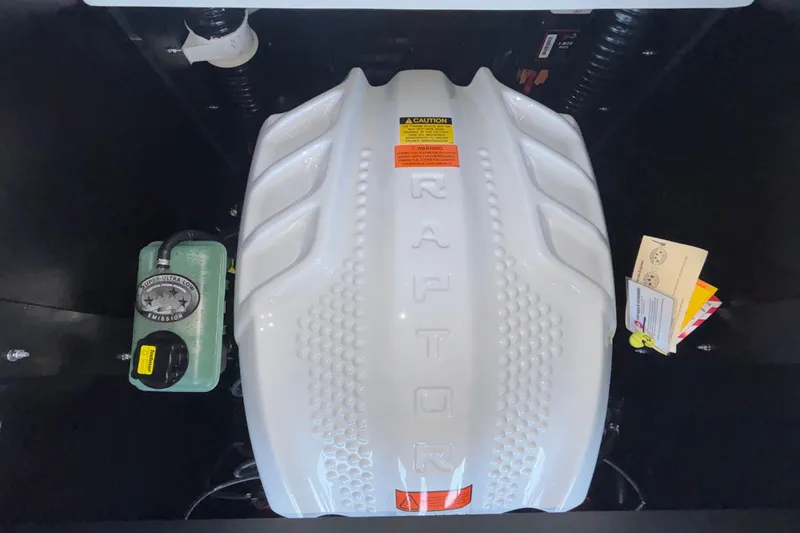 Slide: The Image of Engine compartment of 2026 Tigé 24RZX boat featuring Raptor engine cover. - 17