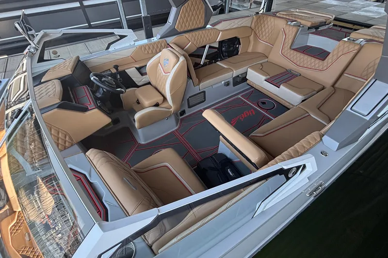 Slide: The Image of Luxurious interior of 2026 Tigé 24RZX boat with tan leather seating and modern design. - 2