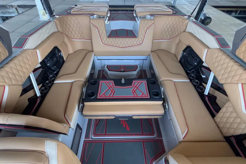 Slide: The Image of Luxurious interior of 2026 Tigé 24RZX boat with tan leather seating and modern design. - 23