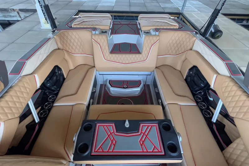 Slide: The Image of Luxurious interior of 2026 Tigé 24RZX boat with tan leather seating and modern design. - 25