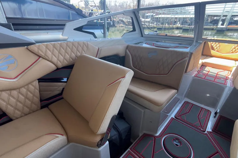 Slide: The Image of Luxurious interior of 2026 Tigé 24RZX boat with tan seating and modern design. - 32