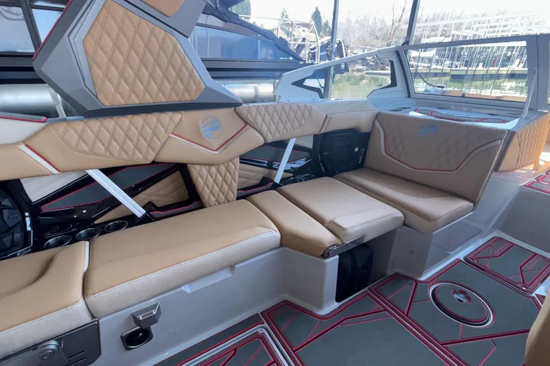 Slide: The Image of Luxurious interior of 2026 Tigé 24RZX boat with tan quilted seating and modern design. - 33