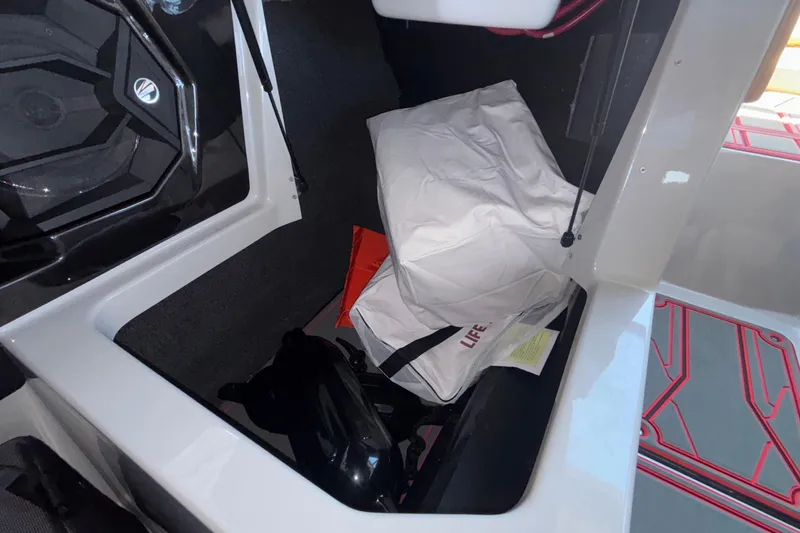 Slide: The Image of Storage compartment in 2026 Tigé 24RZX boat with life jackets and equipment. - 39