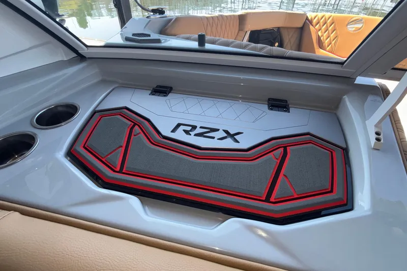 Slide: The Image of 2026 Tigé 24RZX boat interior with stylish RZX branding and cup holders. - 40