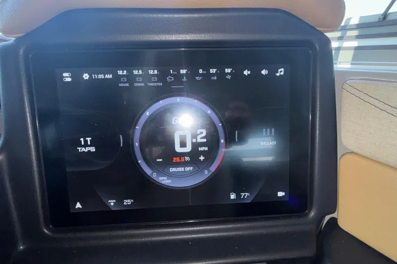 Slide: The Image of Dashboard display of 2026 Tigé 24RZX boat showing speed, temperature, and settings. - 44
