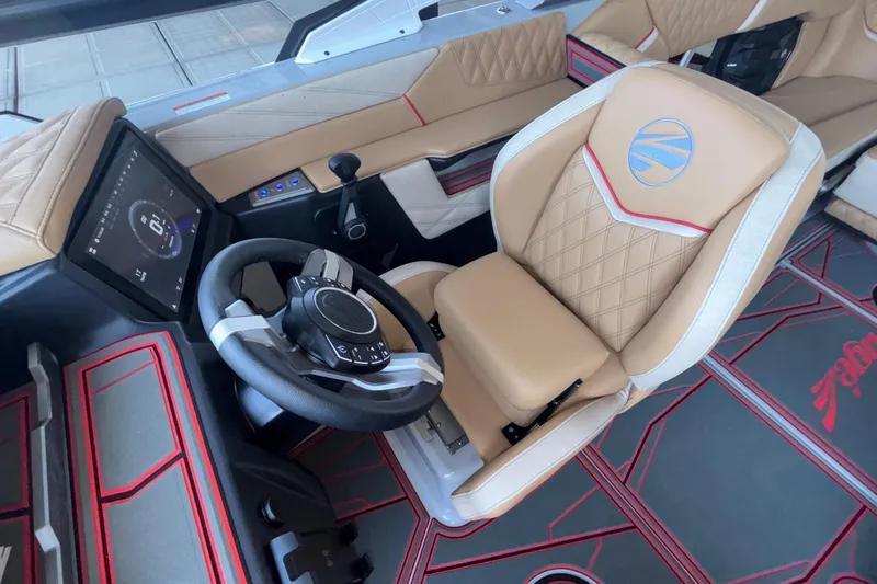 Slide: The Image of 2026 Tigé 24RZX boat interior with modern steering wheel and touchscreen controls. - 47