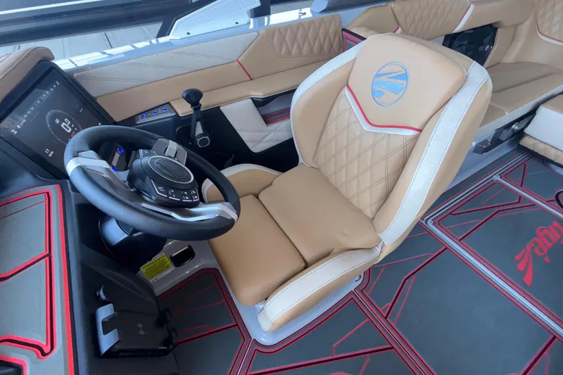 Slide: The Image of Luxurious interior of 2026 Tigé 24RZX boat with modern steering and seating. - 48