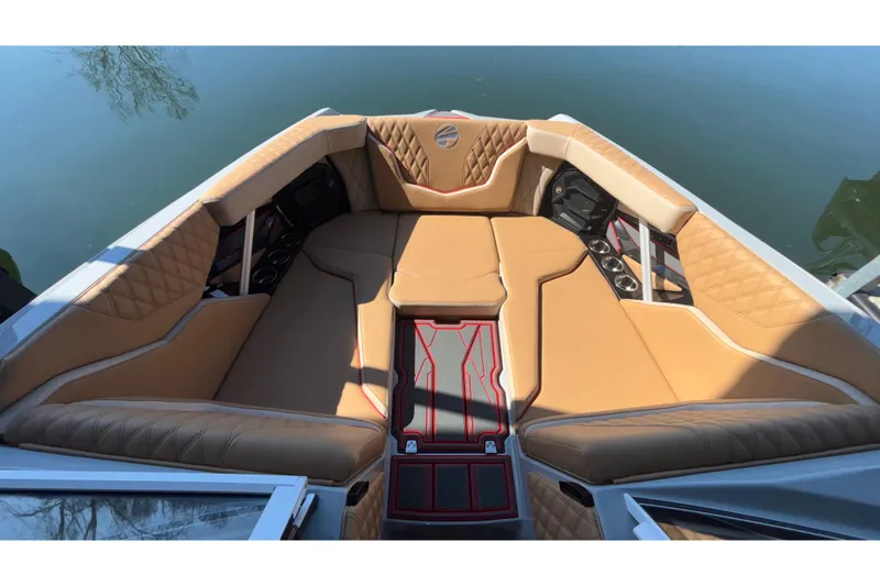 Slide: The Image of Luxurious interior of 2026 Tigé 24RZX boat with tan seating and stylish design. - 55