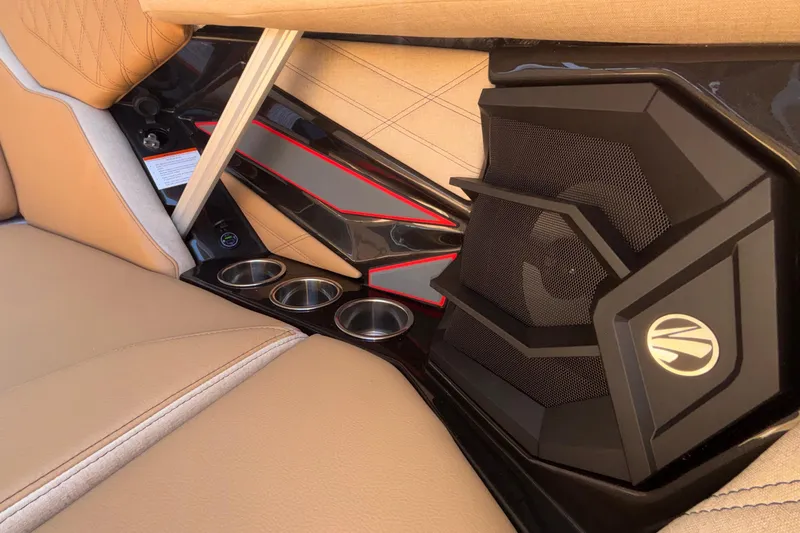 Slide: The Image of Interior of 2026 Tigé 24RZX boat featuring luxury seating and integrated speaker system. - 61