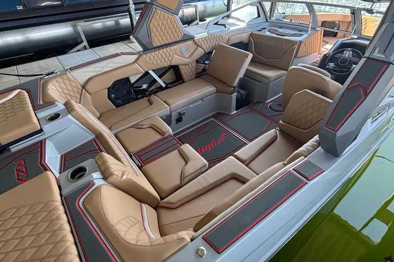 Slide: The Image of Luxurious interior of 2026 Tigé 24RZX boat with tan leather seating and modern design. - 8