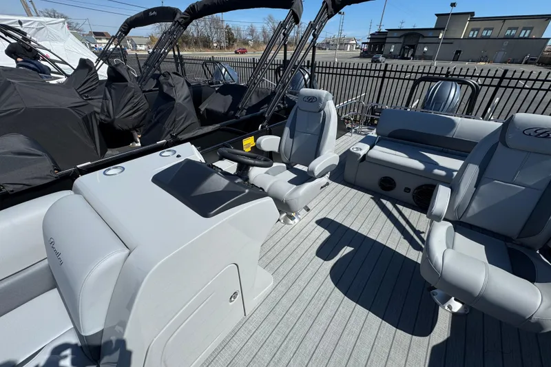 Slide: The Image of 2026 Bentley Pontoons Legacy 243 Swingback interior with luxurious seating and modern design. - 16