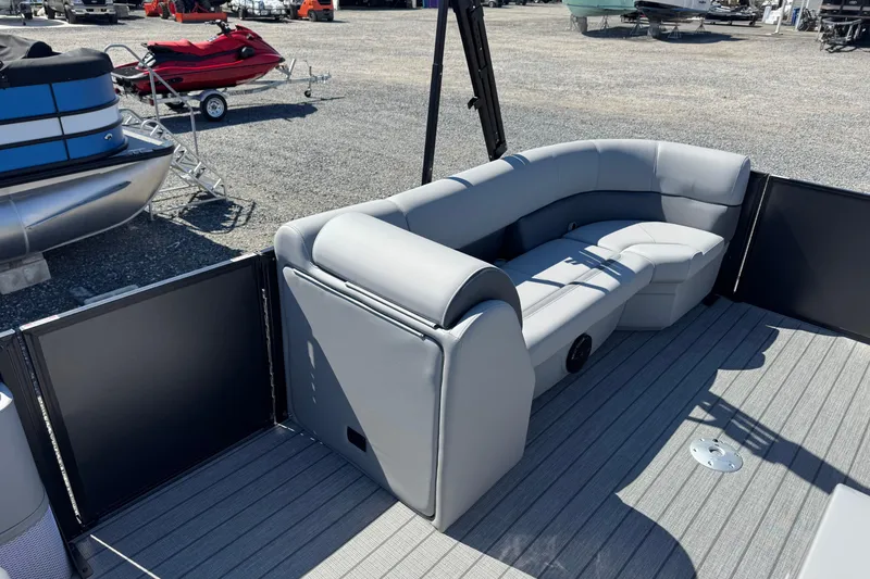 Slide: The Image of 2026 Bentley Pontoons Legacy 243 Swingback with gray seating on a boat deck. - 18