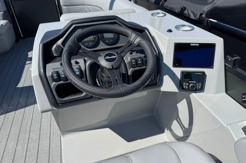 Slide: The Image of 2026 Bentley Pontoons Legacy 243 Swingback helm with steering wheel and control panel. - 8