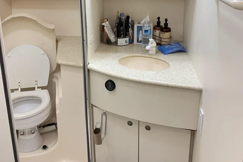 Slide: The Image of Bathroom interior of a 1998 Silverton 361 Express yacht with sink and toilet. - 14