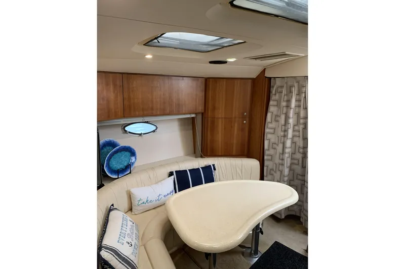 Slide: The Image of Interior of 1998 Silverton 361 Express yacht with cozy seating and stylish decor. - 19