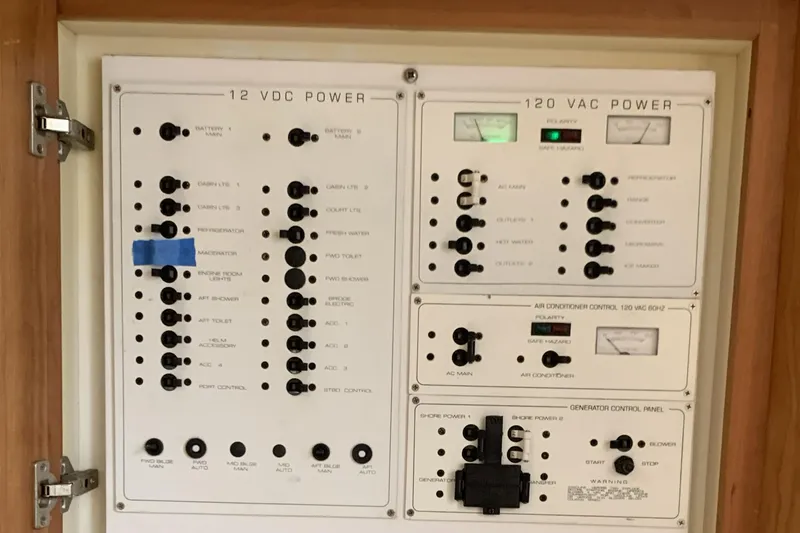 Slide: The Image of Electrical control panel on a 1998 Silverton 361 Express boat, featuring 12 VDC and 120 VAC systems. - 20