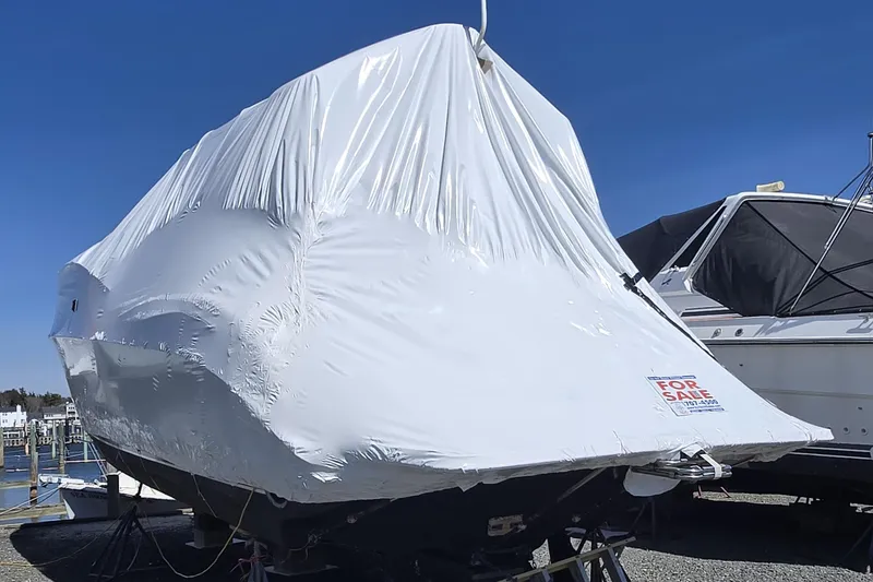 Slide: The Image of 1998 Silverton 361 Express boat covered and for sale at a marina. - 27