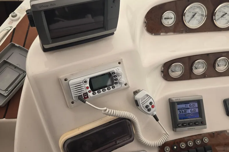 Slide: The Image of Control panel of a 1998 Silverton 361 Express boat with navigation and communication equipment. - 4