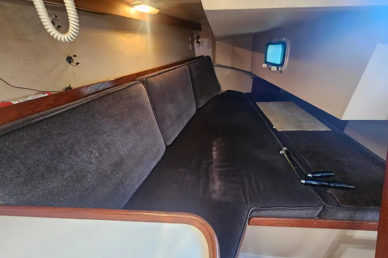 Slide: The Image of Interior cabin of a 1988 Catalina 30 MkII sailboat with cushioned seating. - 18