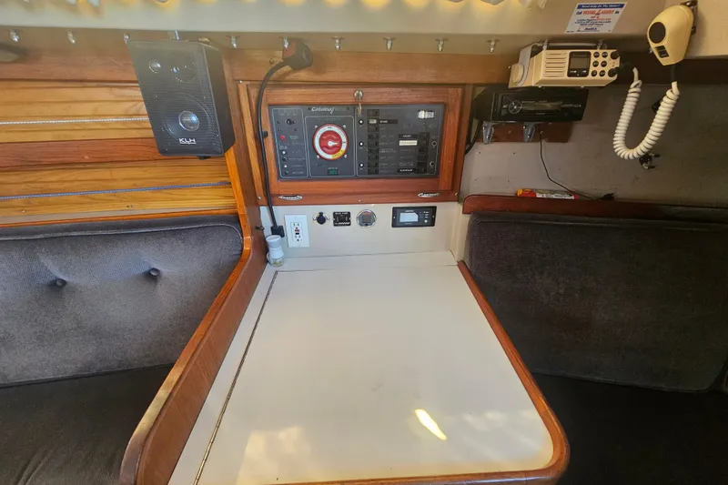 Slide: The Image of Navigation station of a 1988 Catalina 30 MkII sailboat with control panel and radio equipment. - 22
